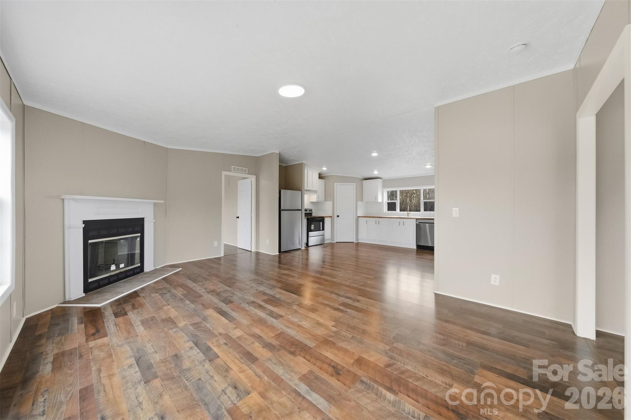 3150 Cranberry Road Boonville, NC 27011 - Photo 9 of 45 a view of a kitchen with a sink and a fireplace