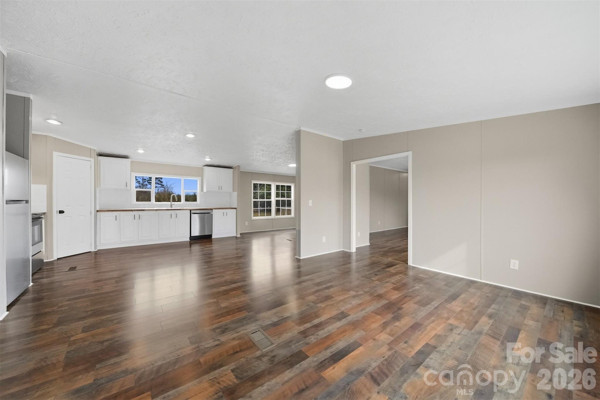 3150 Cranberry Road Boonville, NC 27011 - Photo 10 of 45 a view of a kitchen with wooden floor and a kitchen