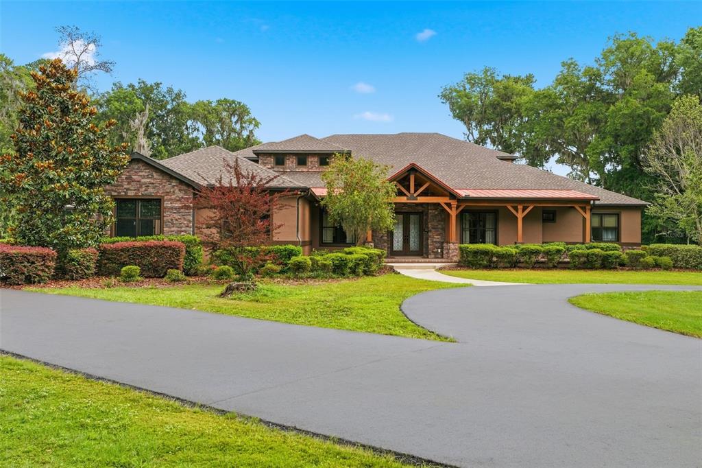 855 Southeast 87th Street Ocala, FL 34480 - Photo 2 of 79 a front view of house with yard and green space