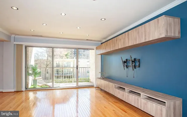 a view of an empty room with a window