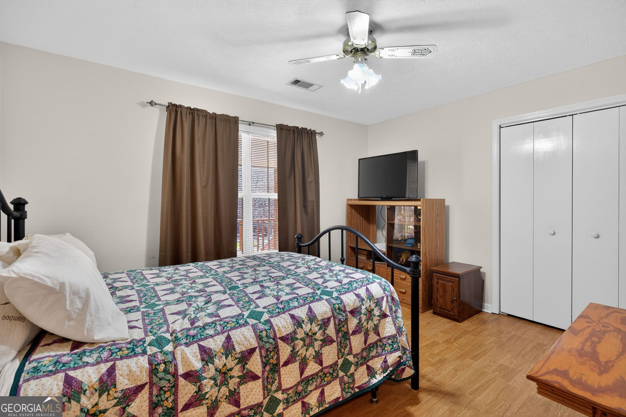 5010 Highway 27 Franklin, GA 30217 - Photo 12 of 39 a bedroom with a bed and a flat screen tv