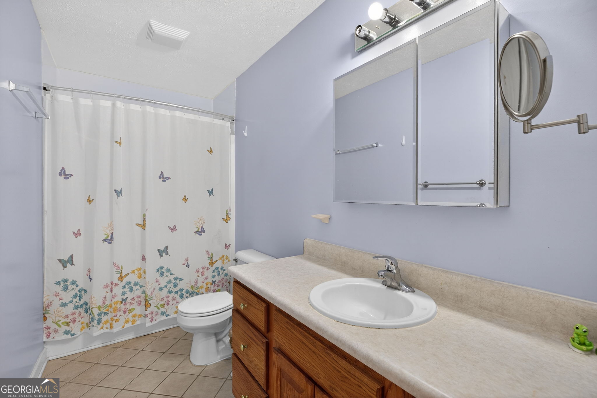 5010 Highway 27 Franklin, GA 30217 - Photo 13 of 39 a bathroom with a granite countertop sink a toilet and a mirror