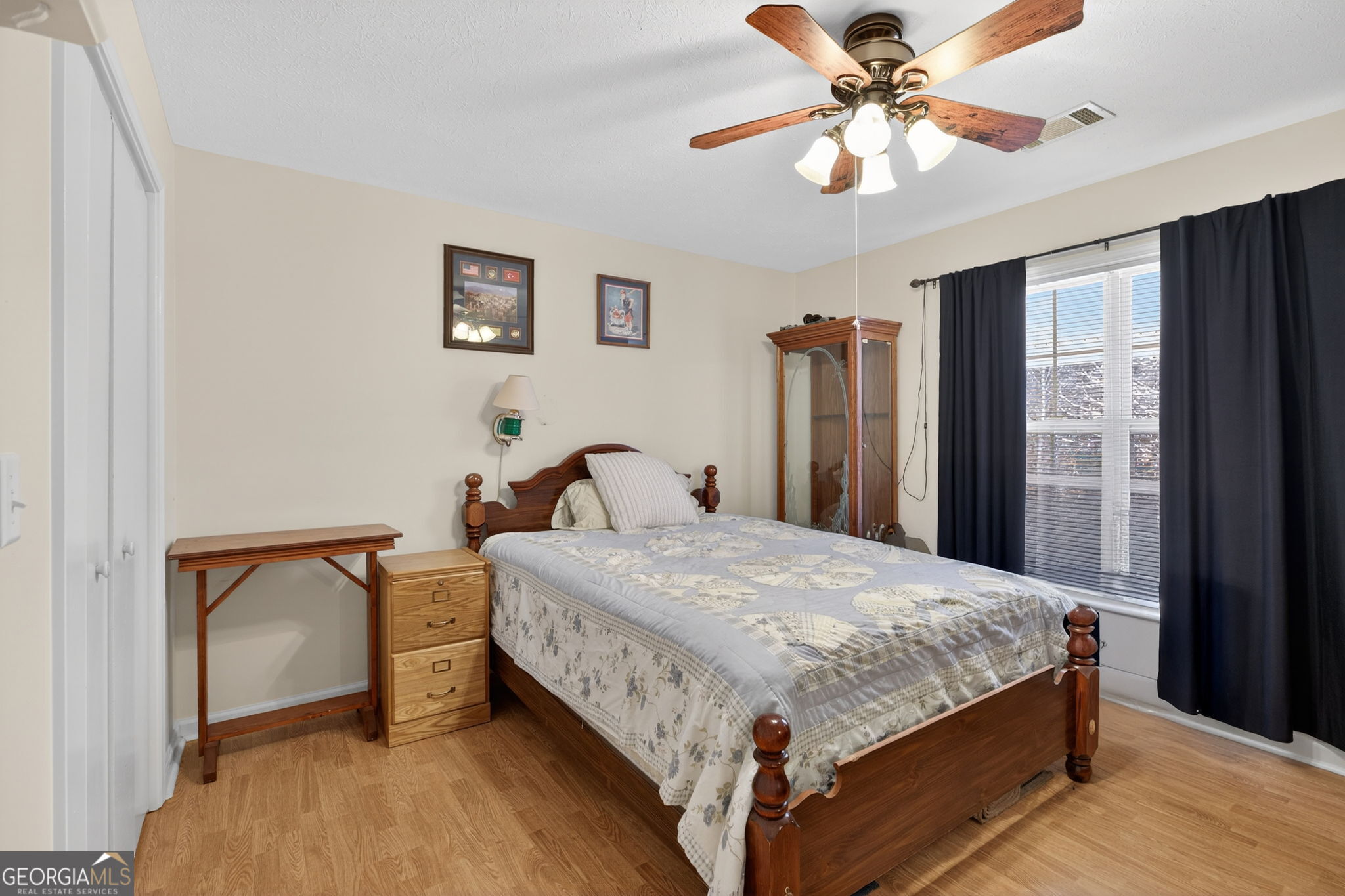 5010 Highway 27 Franklin, GA 30217 - Photo 14 of 39 a bedroom with a bed and a chandelier