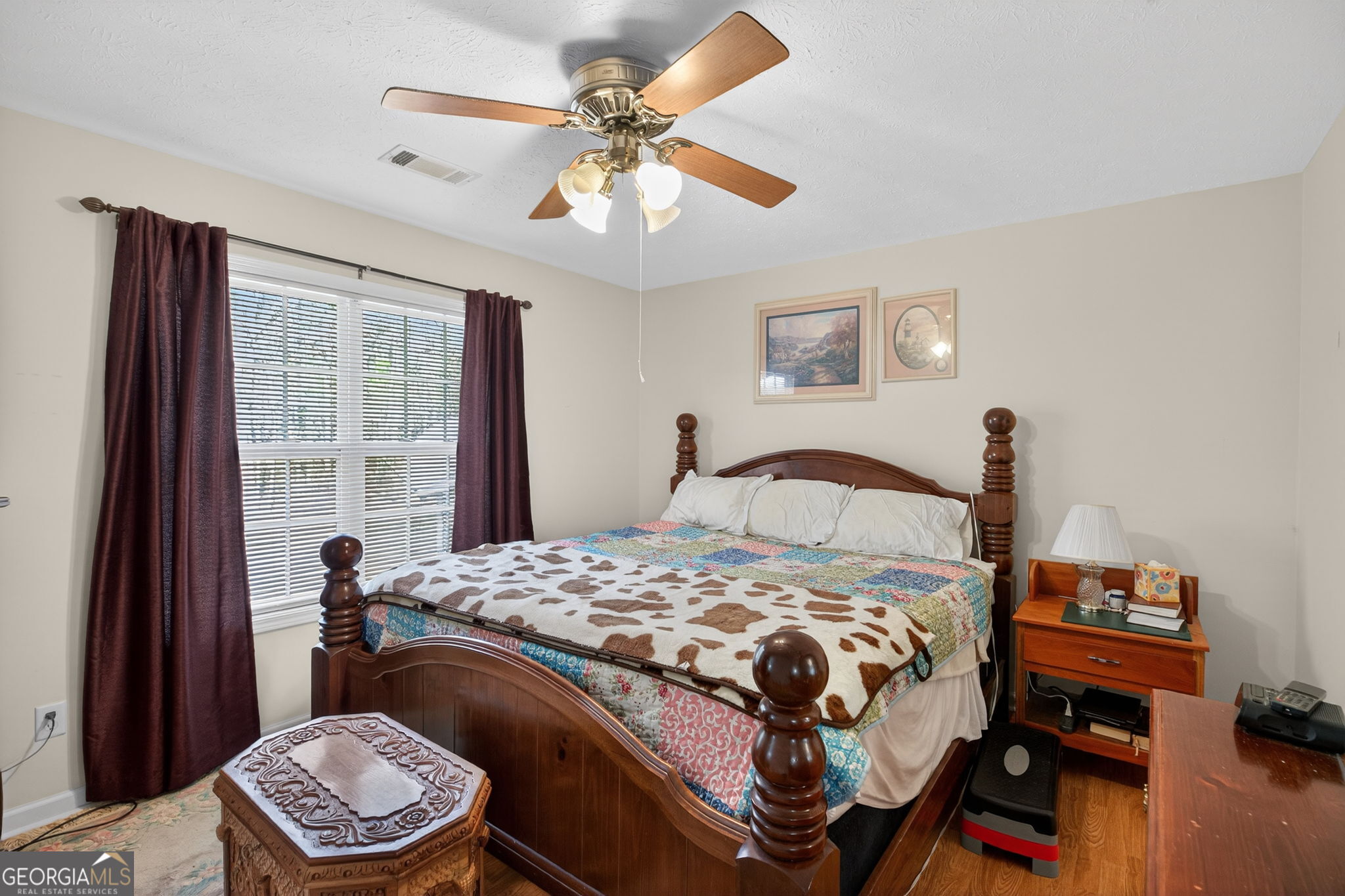 5010 Highway 27 Franklin, GA 30217 - Photo 15 of 39 a bedroom with a bed and a chandelier