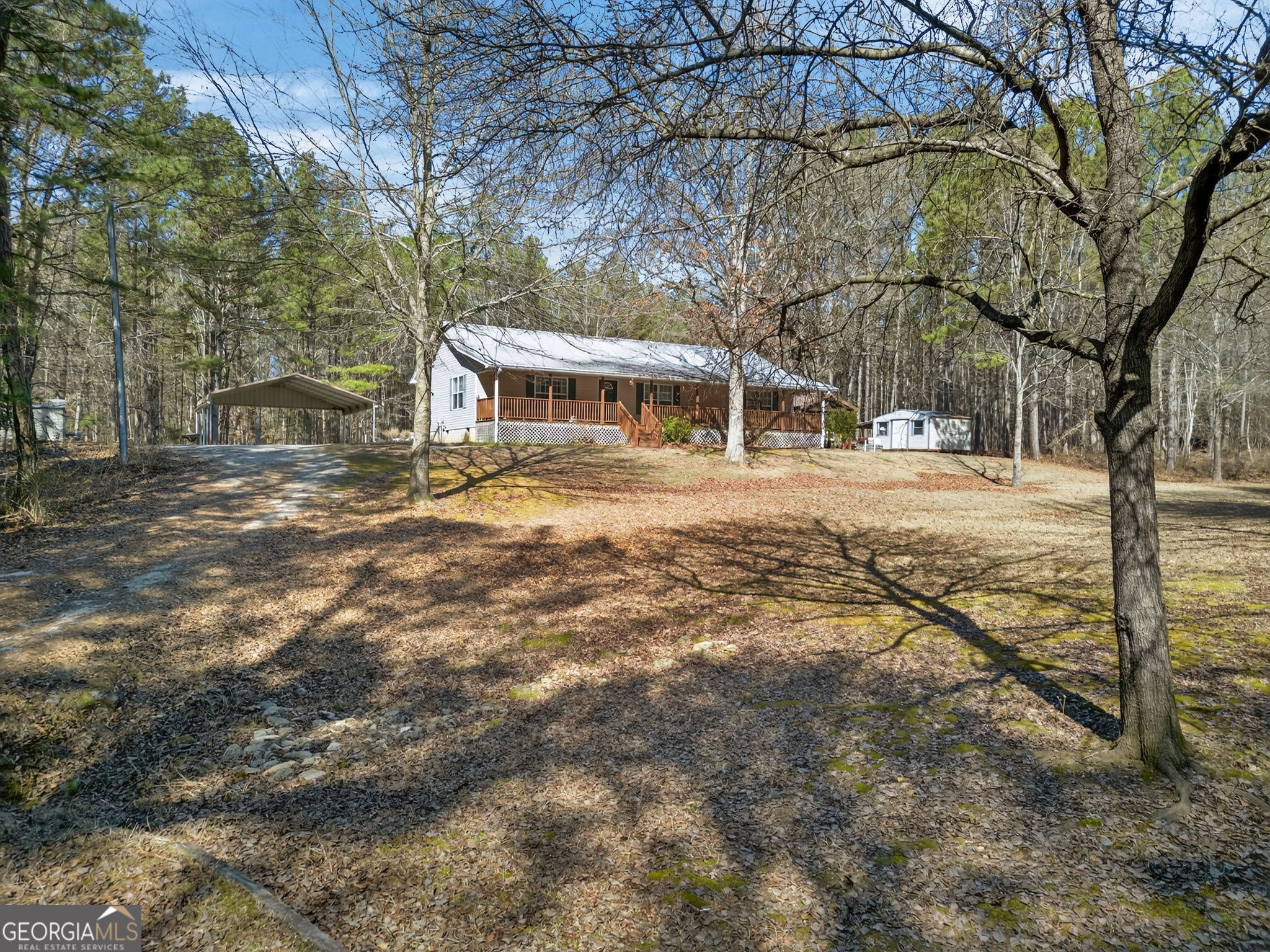 5010 Highway 27 Franklin, GA 30217 - Photo 2 of 39 a view of a yard in front of a house with large trees