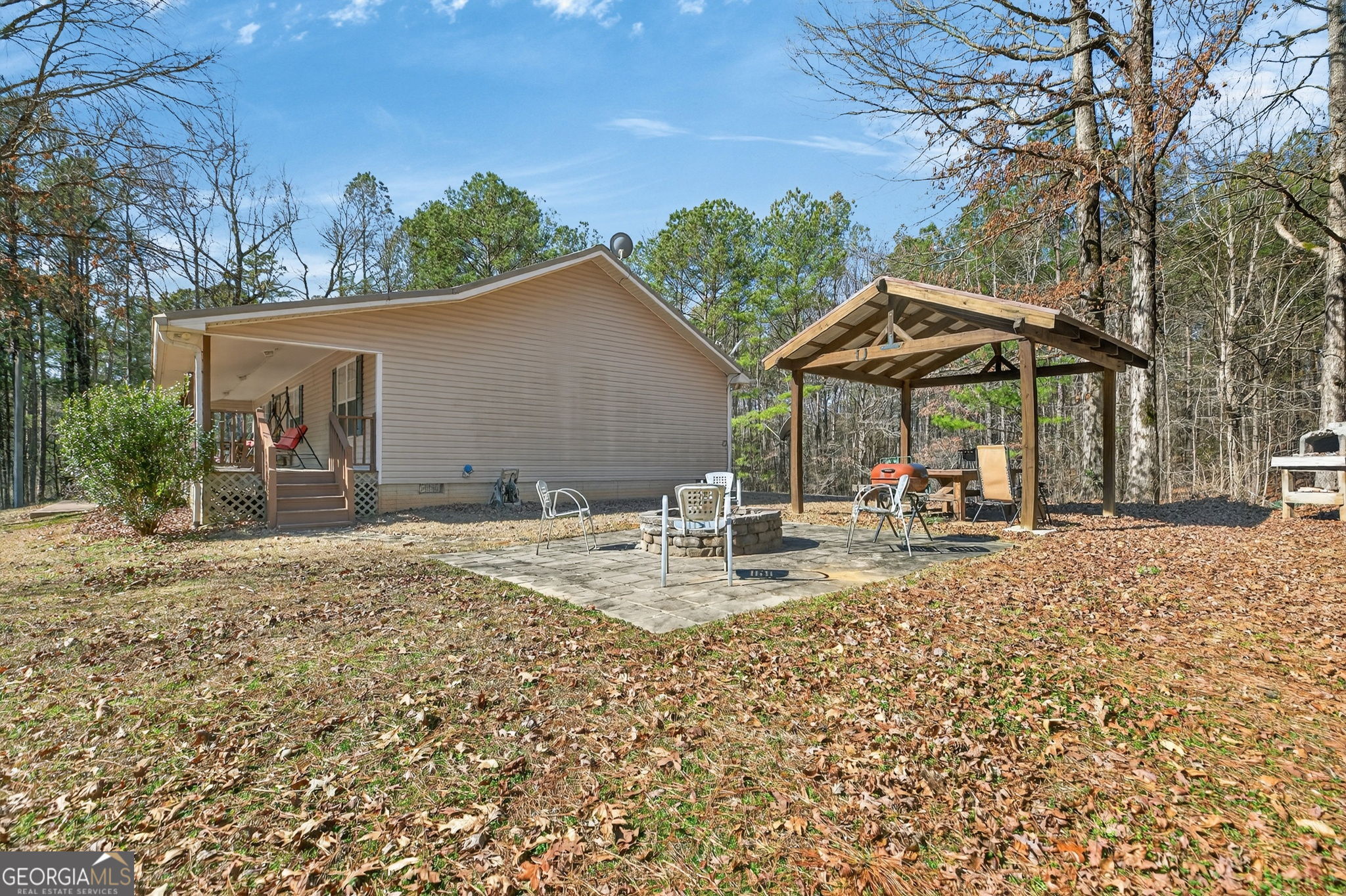5010 Highway 27 Franklin, GA 30217 - Photo 21 of 39 a view of a house with backyard porch and sitting area