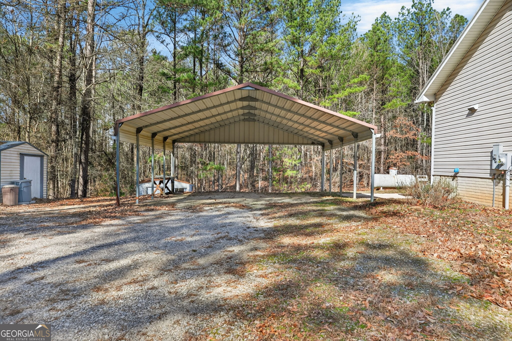 5010 Highway 27 Franklin, GA 30217 - Photo 22 of 39 a view of a patio with a table and chairs under an umbrella