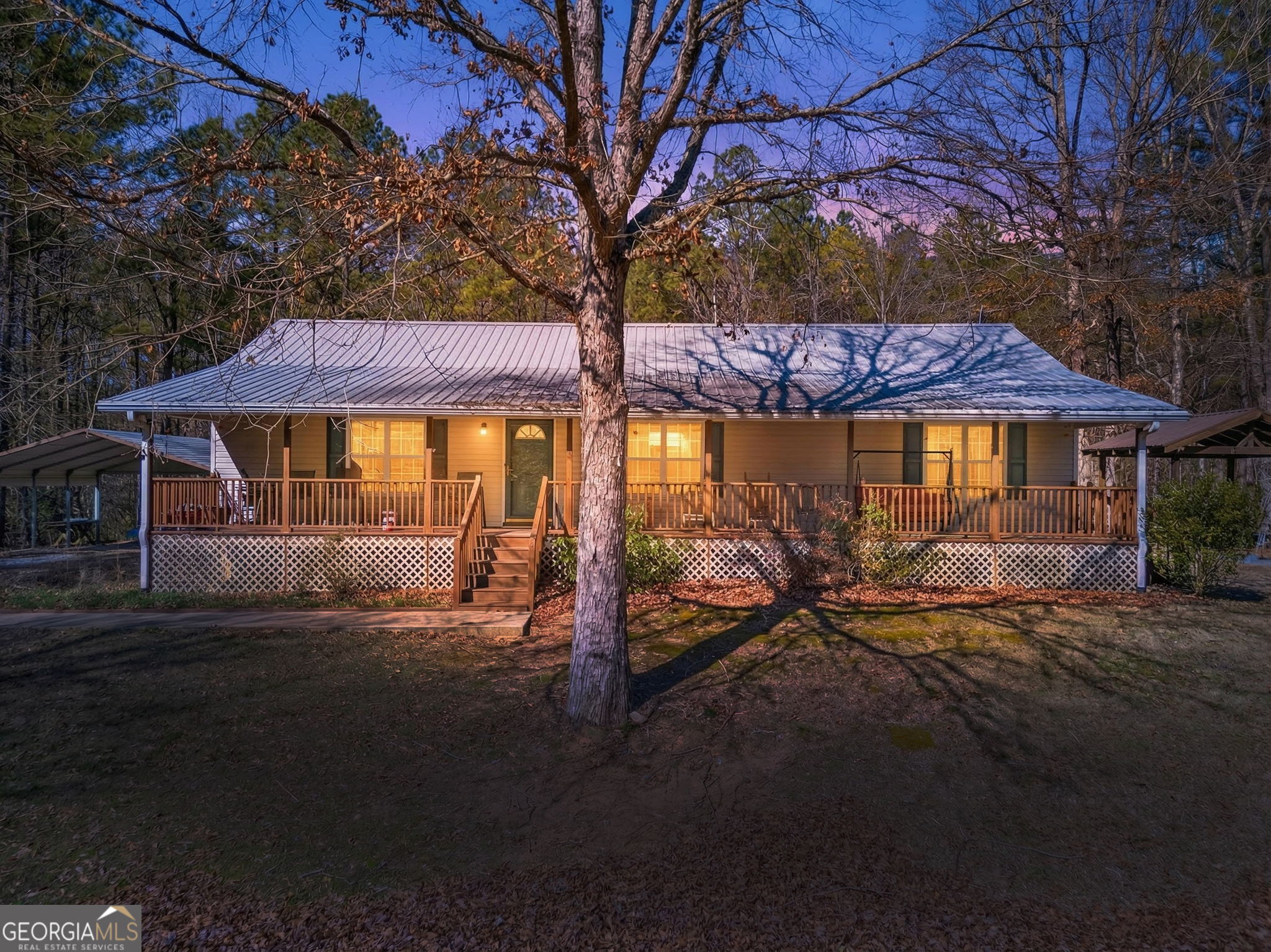 5010 Highway 27 Franklin, GA 30217 - Photo 38 of 39 a patio with a table and chairs under an umbrella