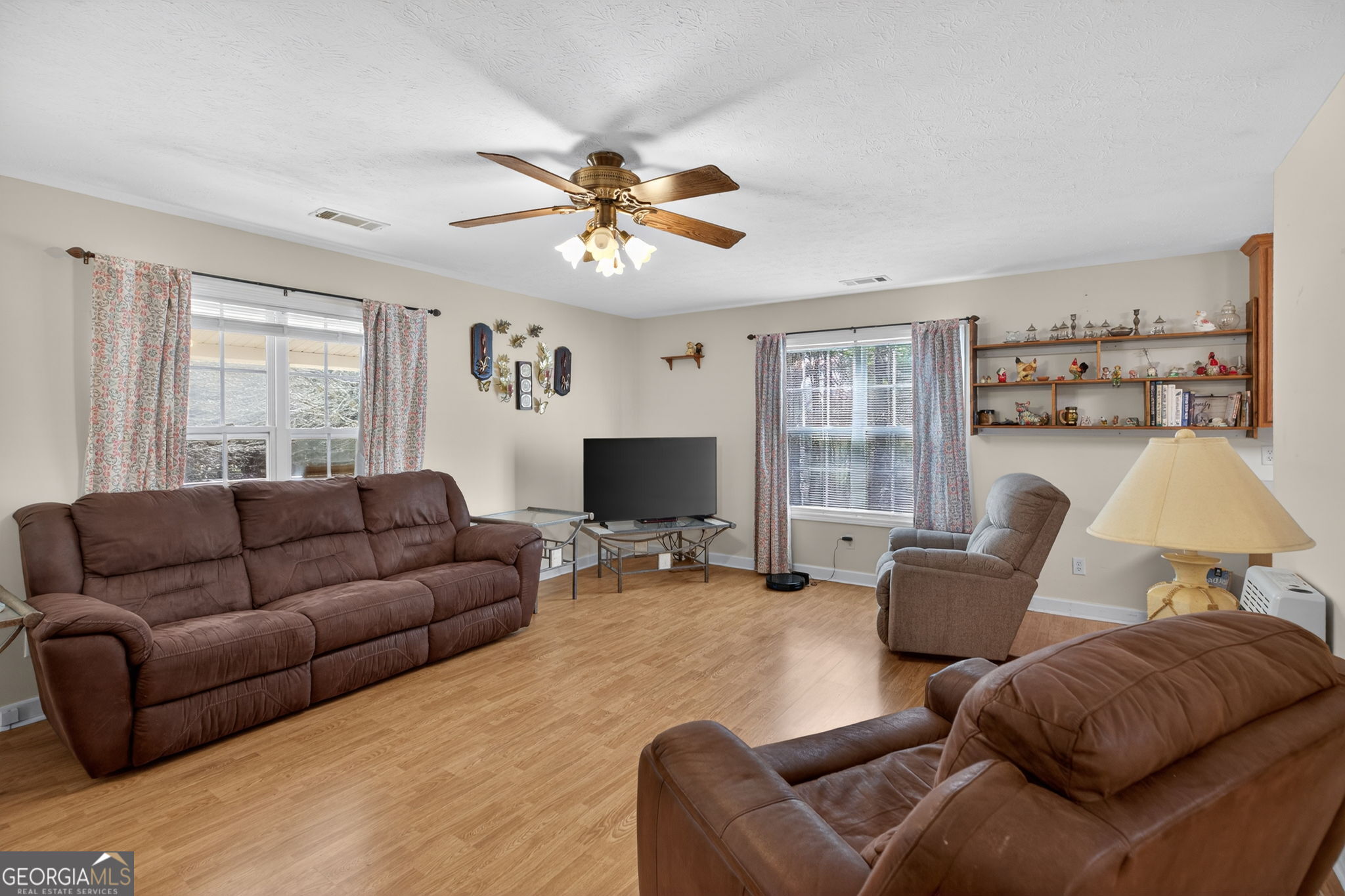 5010 Highway 27 Franklin, GA 30217 - Photo 4 of 39 a living room with furniture and a flat screen tv