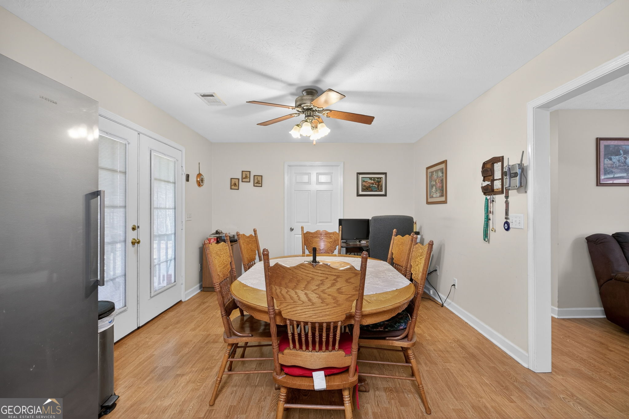5010 Highway 27 Franklin, GA 30217 - Photo 7 of 39 a dining room with furniture and wooden floor