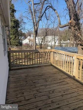 a view of wooden balcony with wooden fence