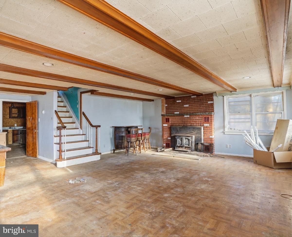103 Ceramic Drive Newfoundland, PA 18445 - Photo 13 of 35 a view of a livingroom with a fireplace and toys