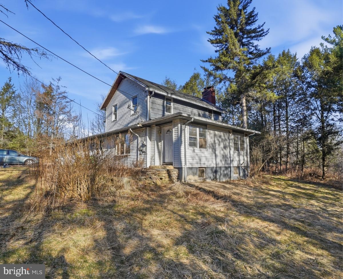 103 Ceramic Drive Newfoundland, PA 18445 - Photo 2 of 35 a view of a house with a tree in the background