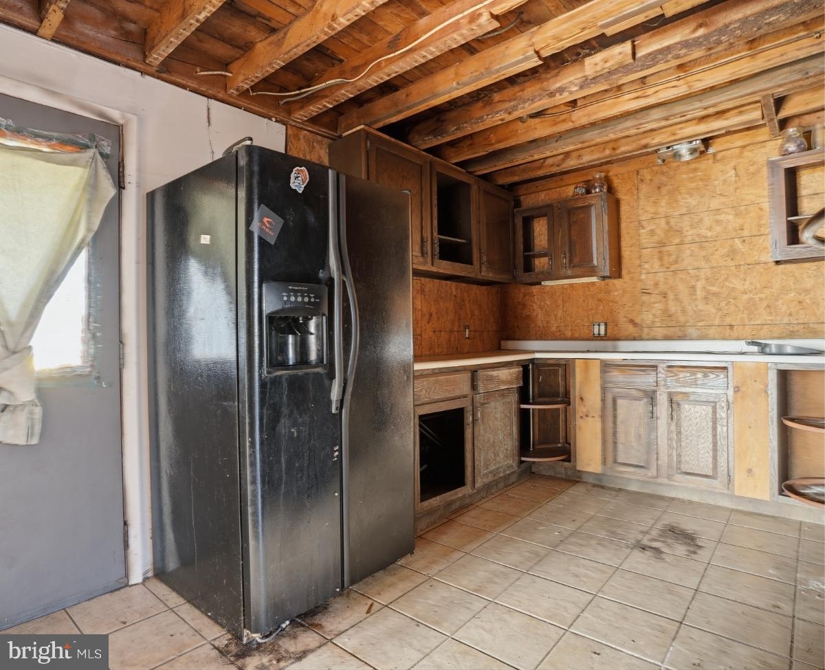 103 Ceramic Drive Newfoundland, PA 18445 - Photo 9 of 35 a kitchen with stainless steel appliances granite countertop a refrigerator and a sink
