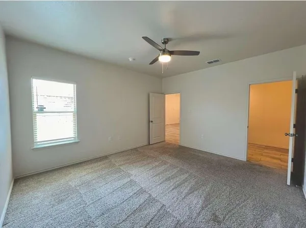 a view of an empty room with a window