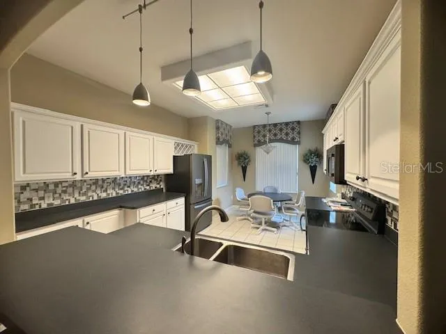 a room with lots of gym equipment and a large window