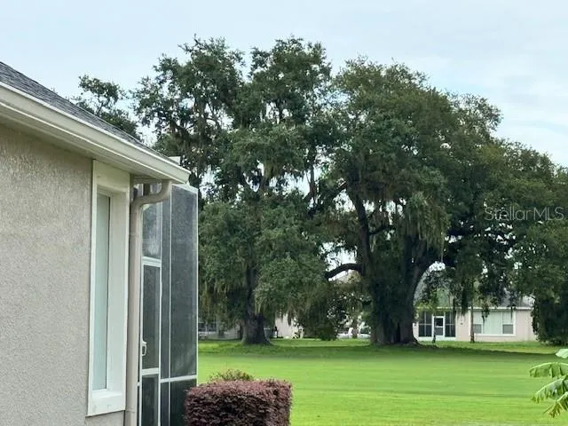 a backyard of a house with lots of green space