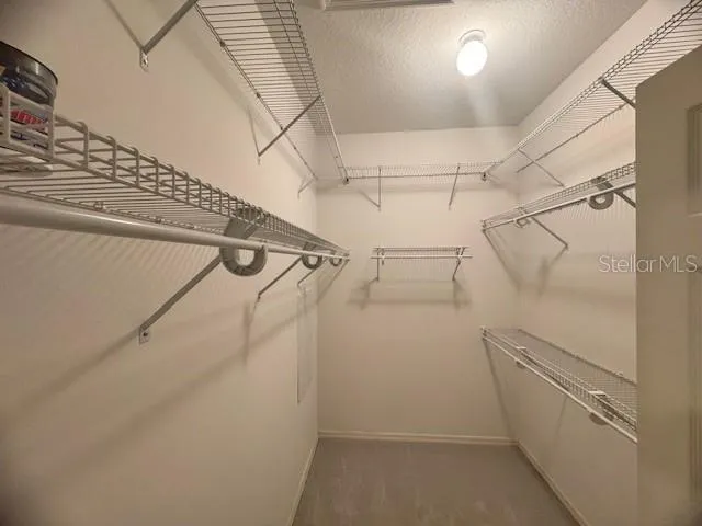 a view of a room with racks on the wall