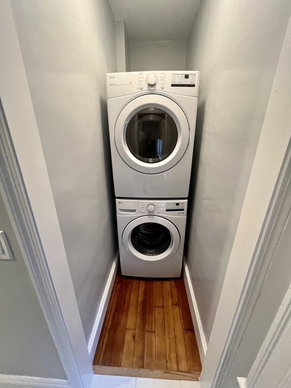 24 Howes Street, Unit 3 Boston, MA 02125 - Photo 9 of 15 a view of a hallway with washer and dryer