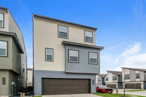 a front view of residential houses with street