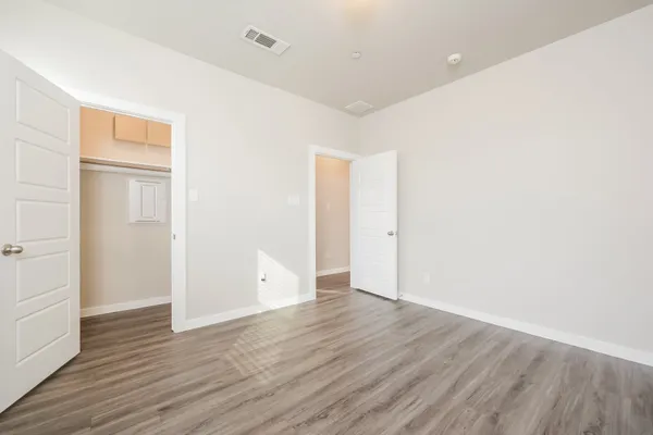 a view of a room with shelf on the wall