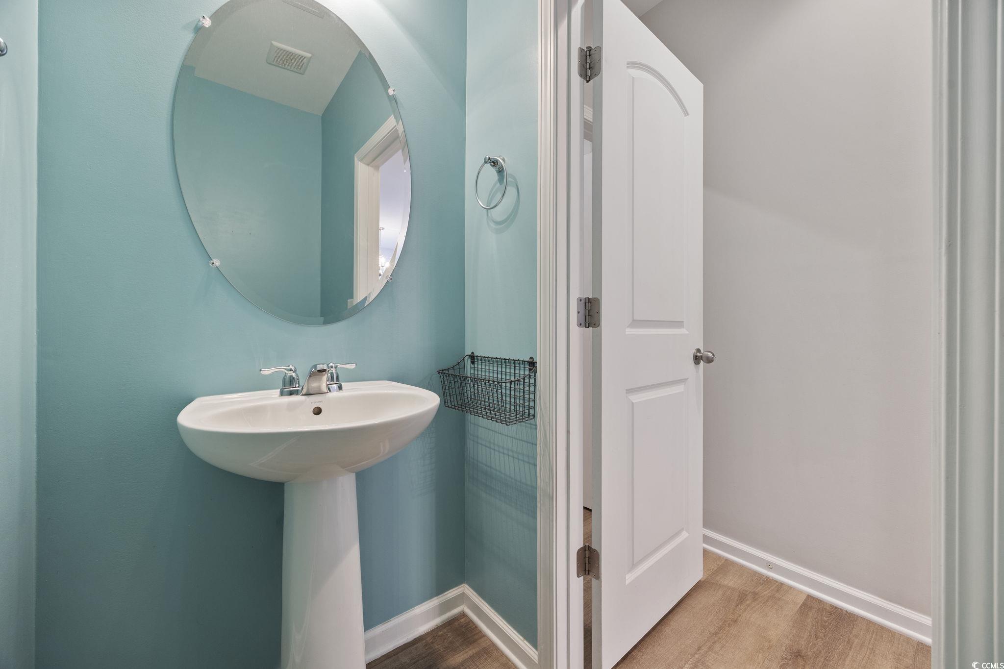 115 Machrie Loop, Unit D Myrtle Beach, SC 29588 - Photo 13 of 40 Bathroom featuring baseboards and wood finished floors