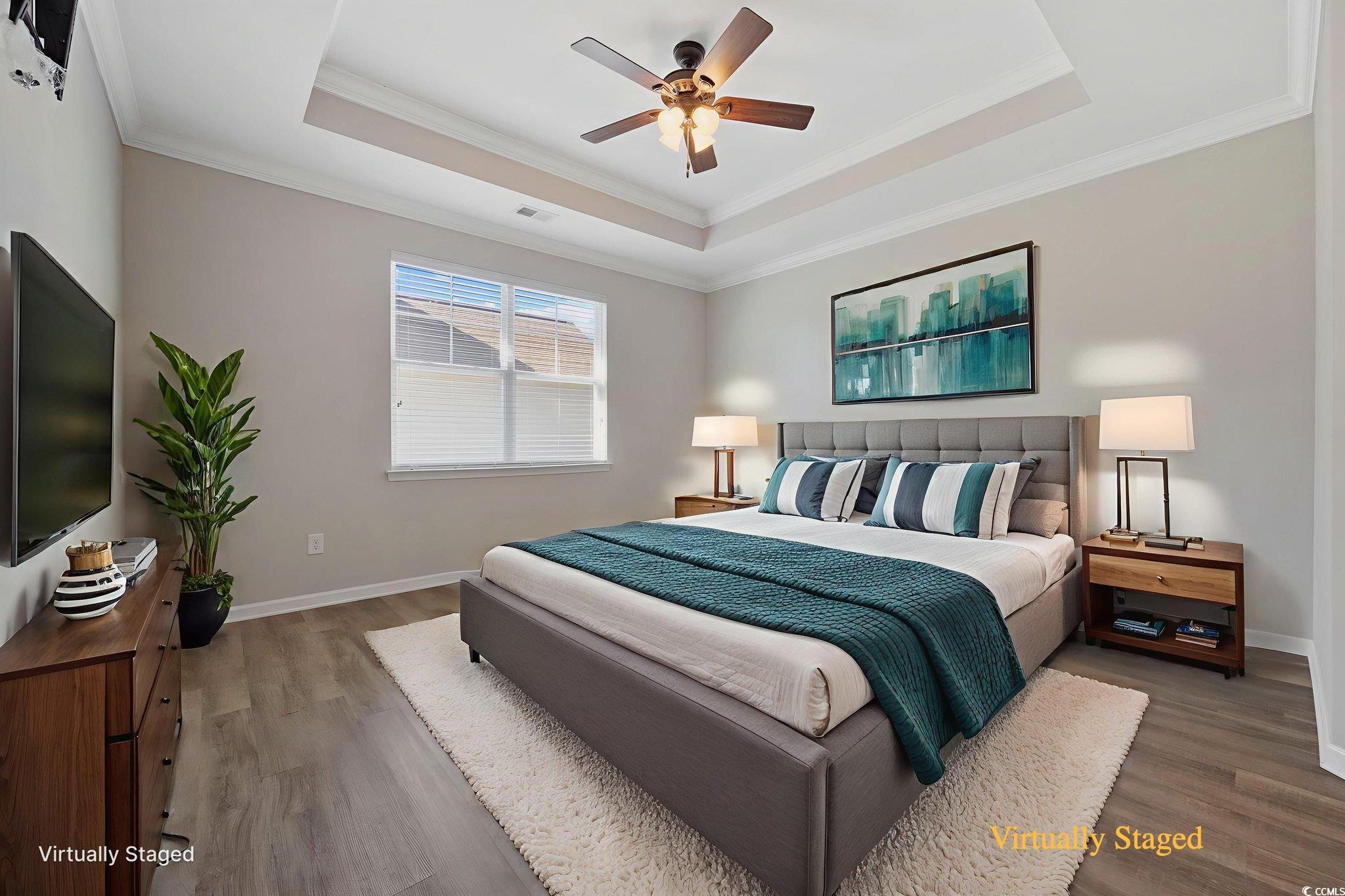 115 Machrie Loop, Unit D Myrtle Beach, SC 29588 - Photo 14 of 40 Bedroom with a raised ceiling, crown molding, wood finished floors, and ceiling fan