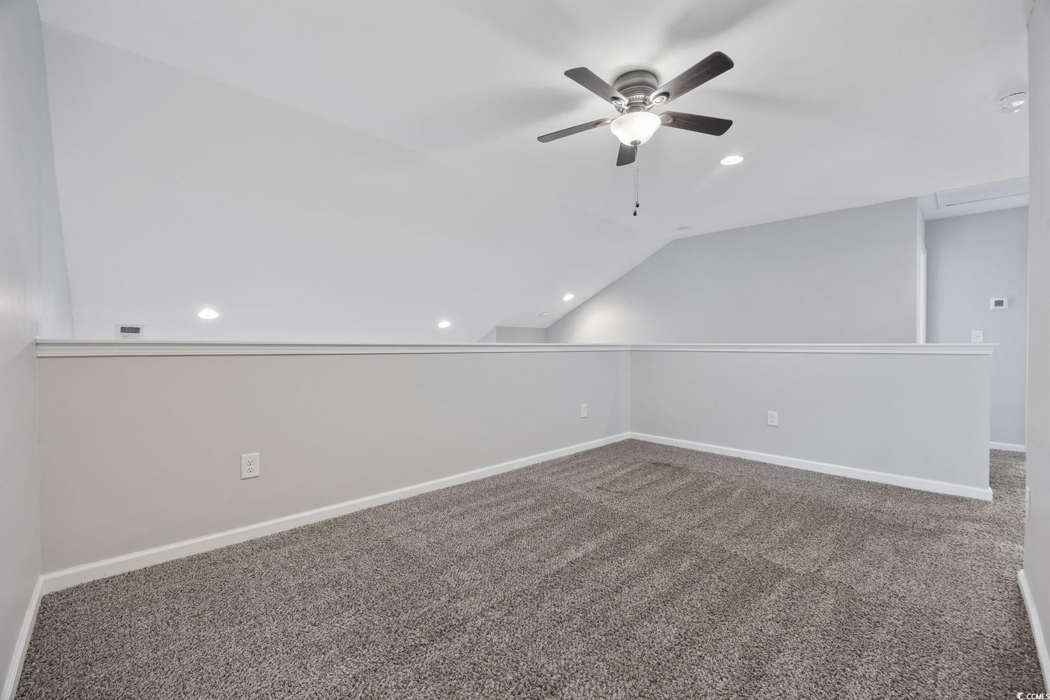 115 Machrie Loop, Unit D Myrtle Beach, SC 29588 - Photo 23 of 40 Unfurnished room featuring vaulted ceiling, recessed lighting, carpet, and ceiling fan