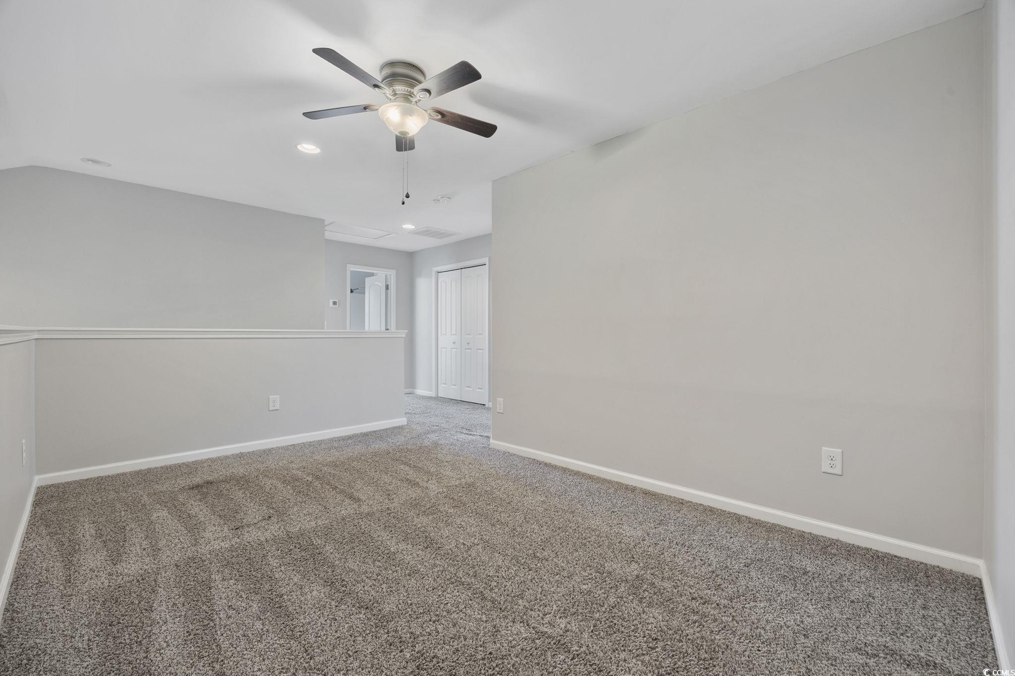 115 Machrie Loop, Unit D Myrtle Beach, SC 29588 - Photo 24 of 40 Carpeted spare room featuring a ceiling fan and recessed lighting
