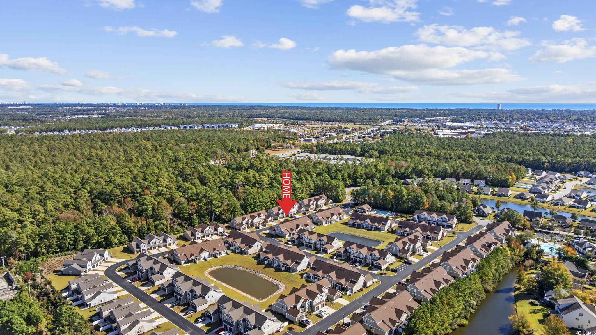 115 Machrie Loop, Unit D Myrtle Beach, SC 29588 - Photo 37 of 40 Aerial view of property's location with nearby suburban area and a nearby body of water