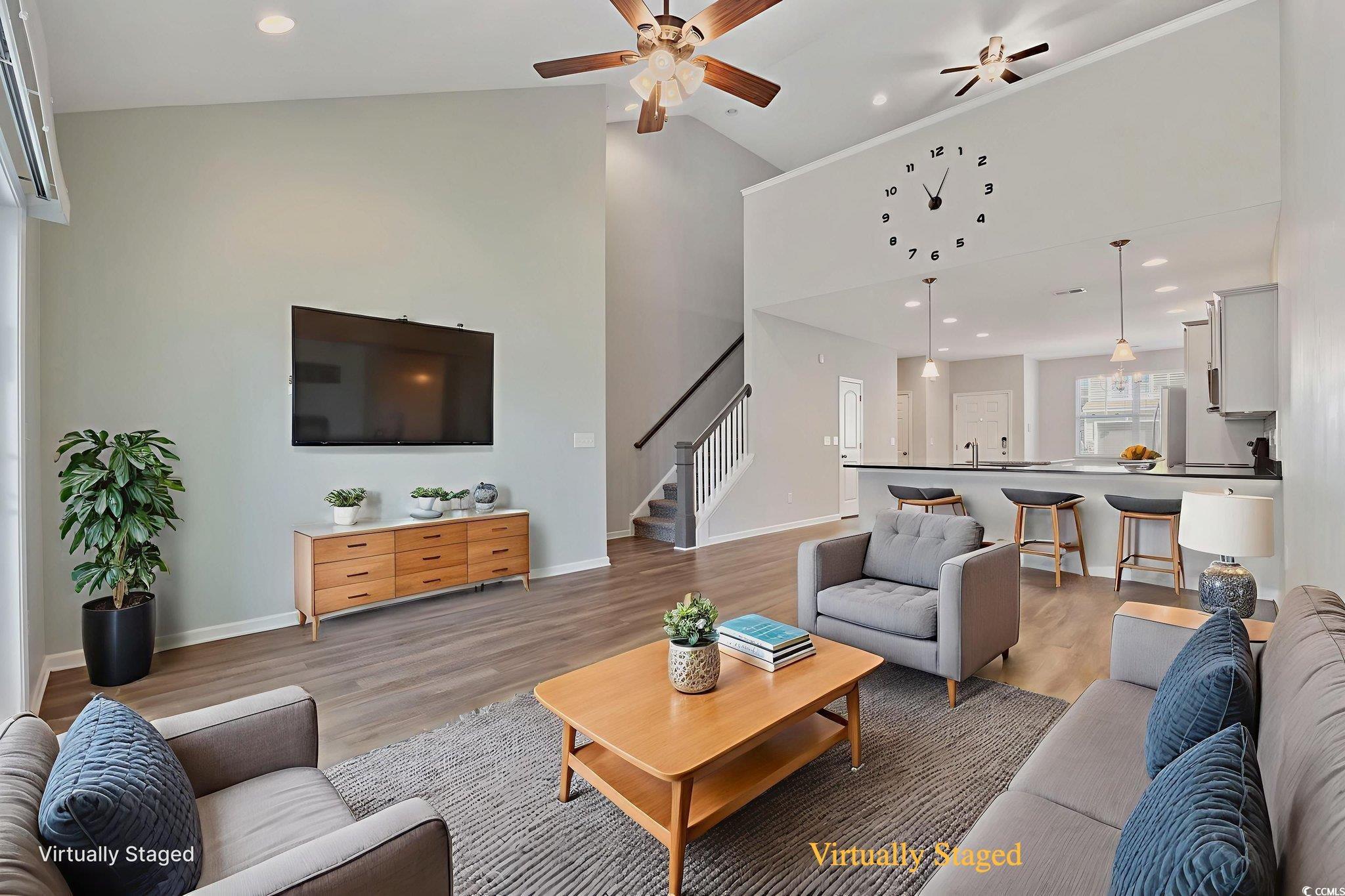 115 Machrie Loop, Unit D Myrtle Beach, SC 29588 - Photo 9 of 40 Living room with ceiling fan, recessed lighting, light wood-style floors, stairway, and high vaulted ceiling