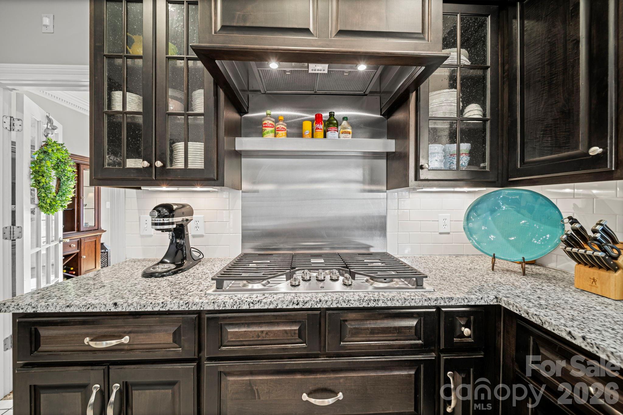 32618 Guard Road Albemarle, NC 28001 - Photo 14 of 48 a kitchen with granite countertop stainless steel appliances stove and cabinets
