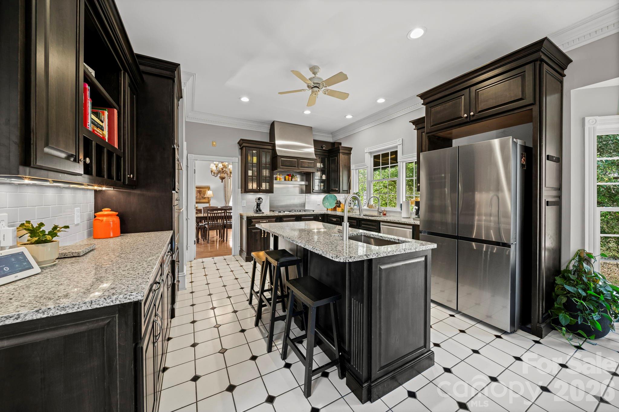 32618 Guard Road Albemarle, NC 28001 - Photo 16 of 48 a kitchen with stainless steel appliances granite countertop a sink a stove and a refrigerator