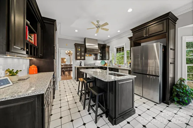 a large bathroom with a double vanity sink a large mirror and a shower
