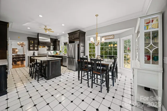 a bathroom with a sink vanity tub and mirror