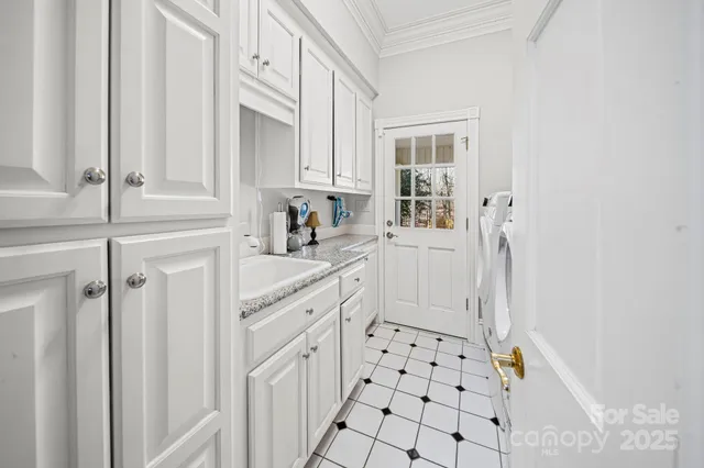 a bathroom with a black white checkered floor