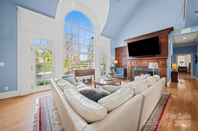 a dining room with a table chairs and a flat screen tv