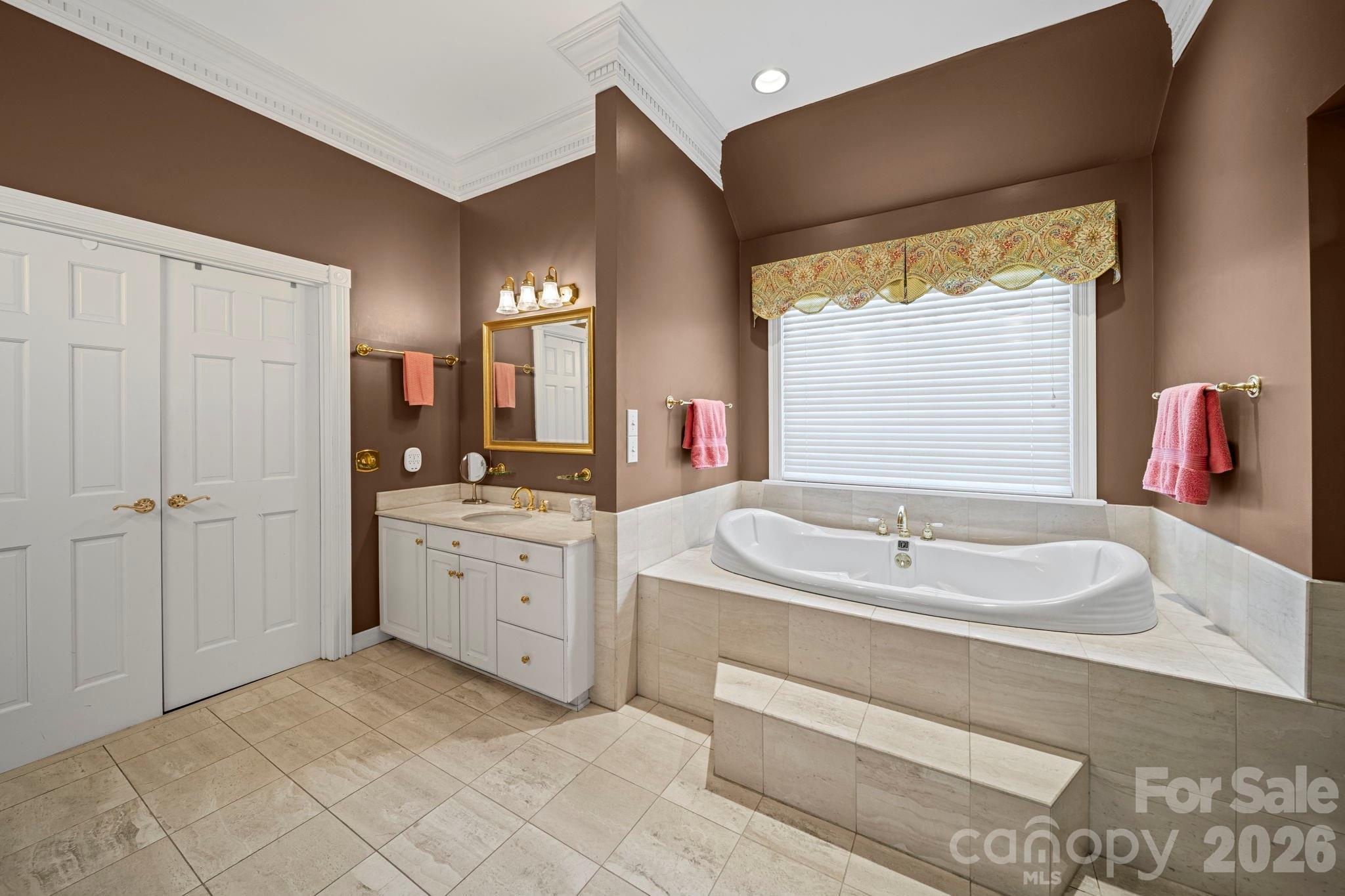 32618 Guard Road Albemarle, NC 28001 - Photo 28 of 48 a spacious bathroom with a sink double vanity and a bathtub