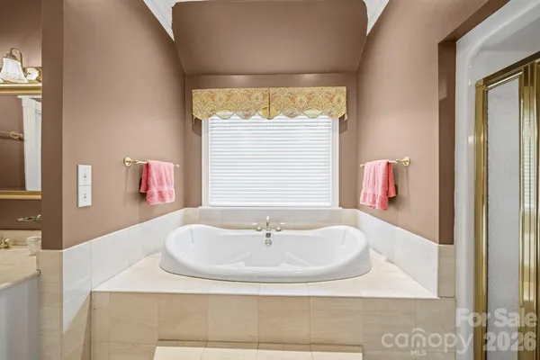 a bedroom with bed and window