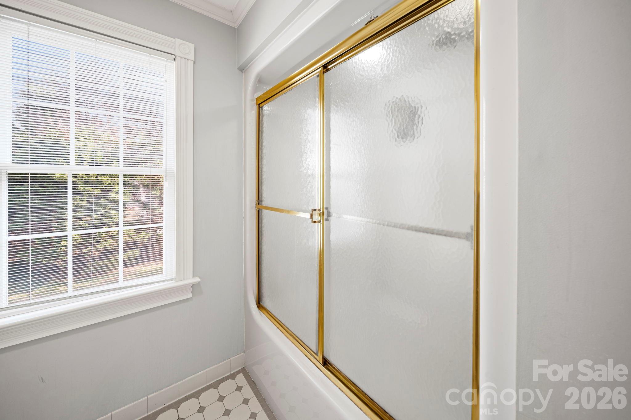 32618 Guard Road Albemarle, NC 28001 - Photo 33 of 48 a bathroom with a glass shower door and sink