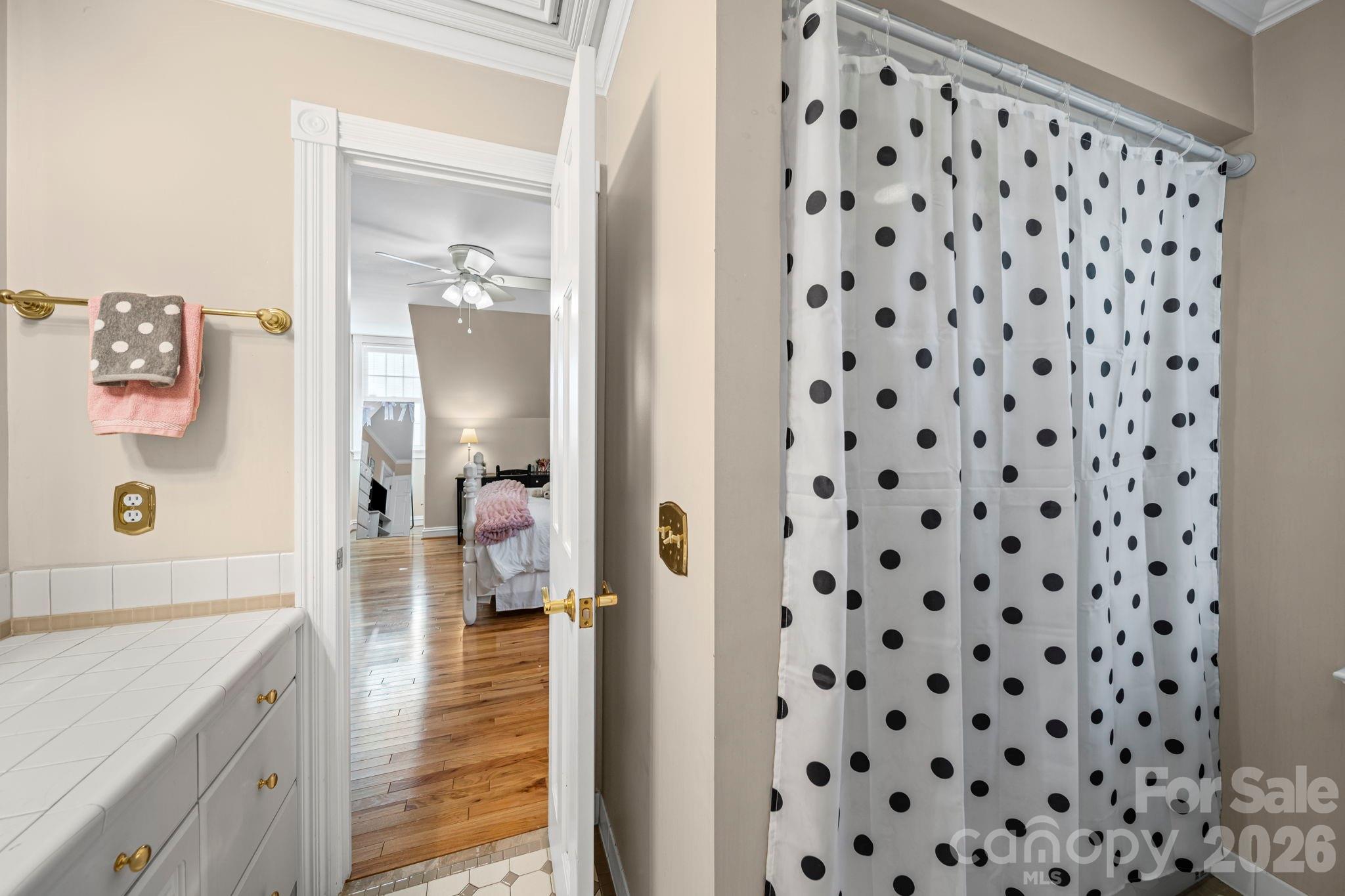 32618 Guard Road Albemarle, NC 28001 - Photo 39 of 48 a bathroom with a black white checkered floor