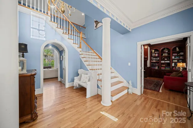 a living room with furniture fireplace and flat screen tv
