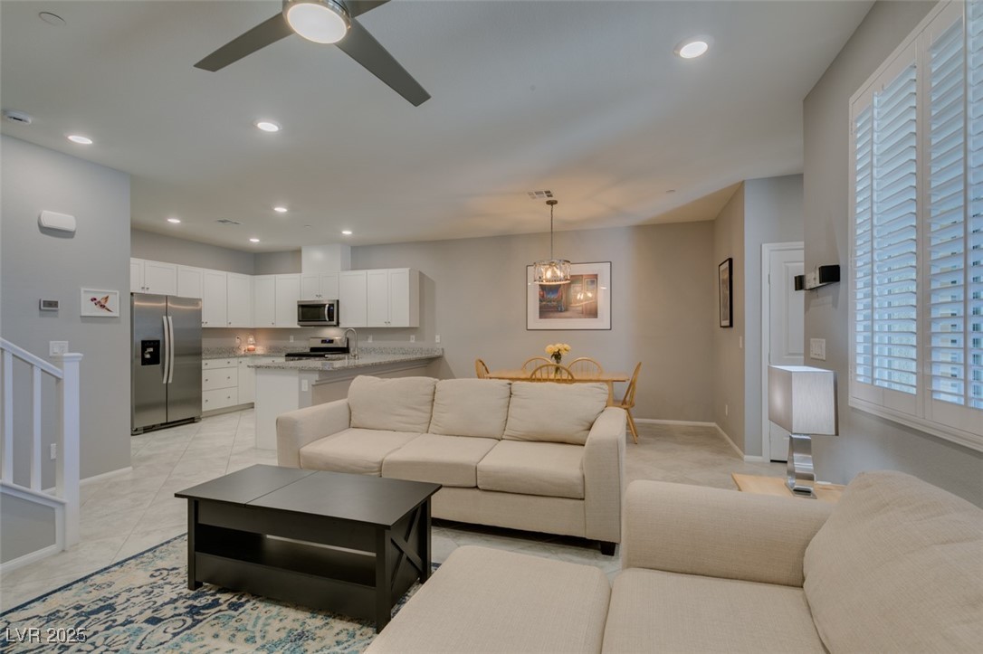2870 Turnstone Ridge Street Henderson, NV 89044 - Photo 12 of 50 Living area featuring a ceiling fan, baseboards, recessed lighting, and light tile patterned floors
