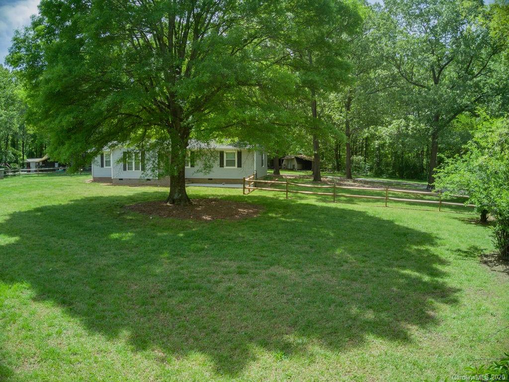 2519 Old Camden Road Monroe, NC 28110 - Photo 1 of 42 a view of a park with trees in the background