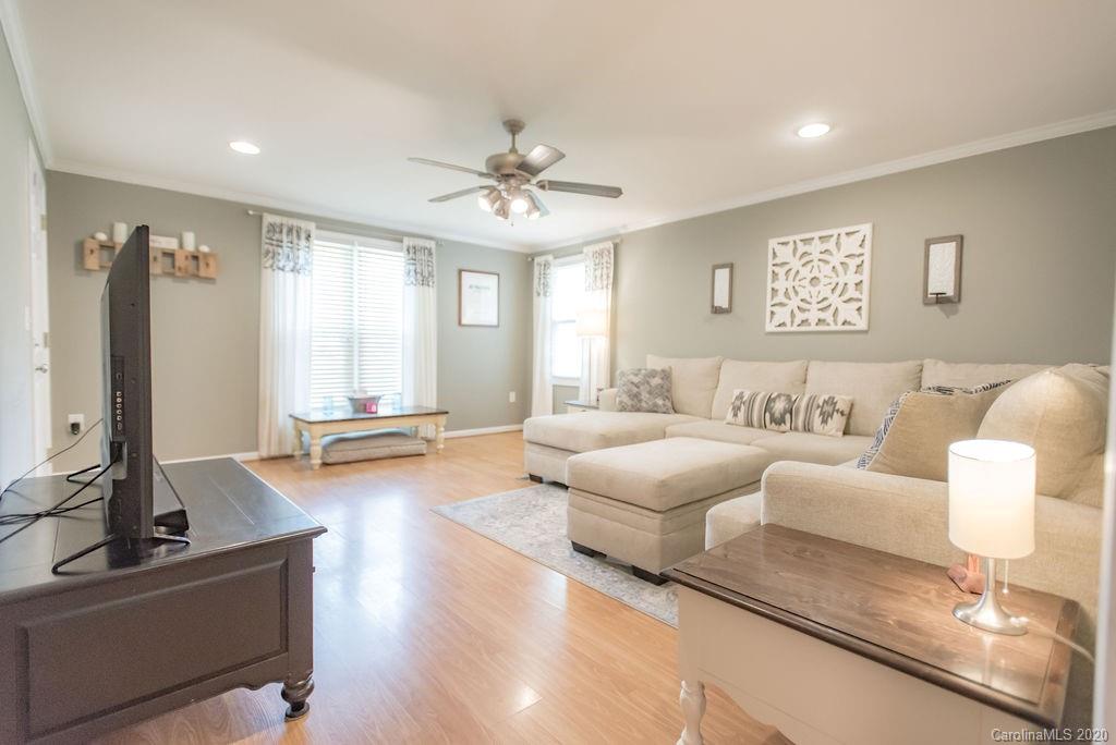 2519 Old Camden Road Monroe, NC 28110 - Photo 13 of 42 a living room with furniture and a flat screen tv