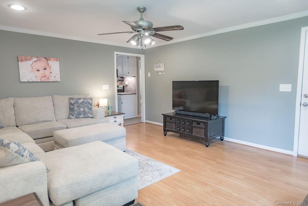 2519 Old Camden Road Monroe, NC 28110 - Photo 16 of 42 a living room with furniture and a flat screen tv