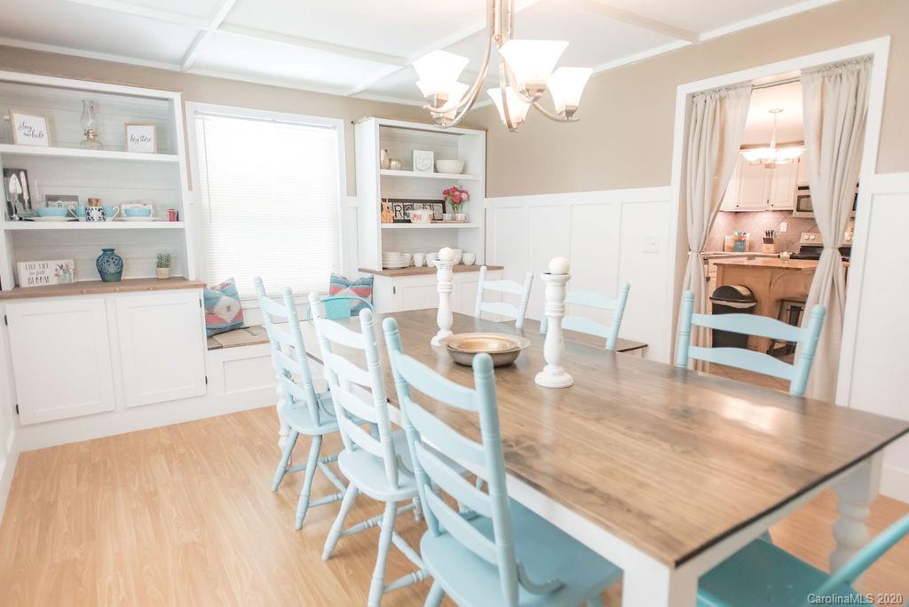 2519 Old Camden Road Monroe, NC 28110 - Photo 18 of 42 a dining room with wooden floor and chandelier