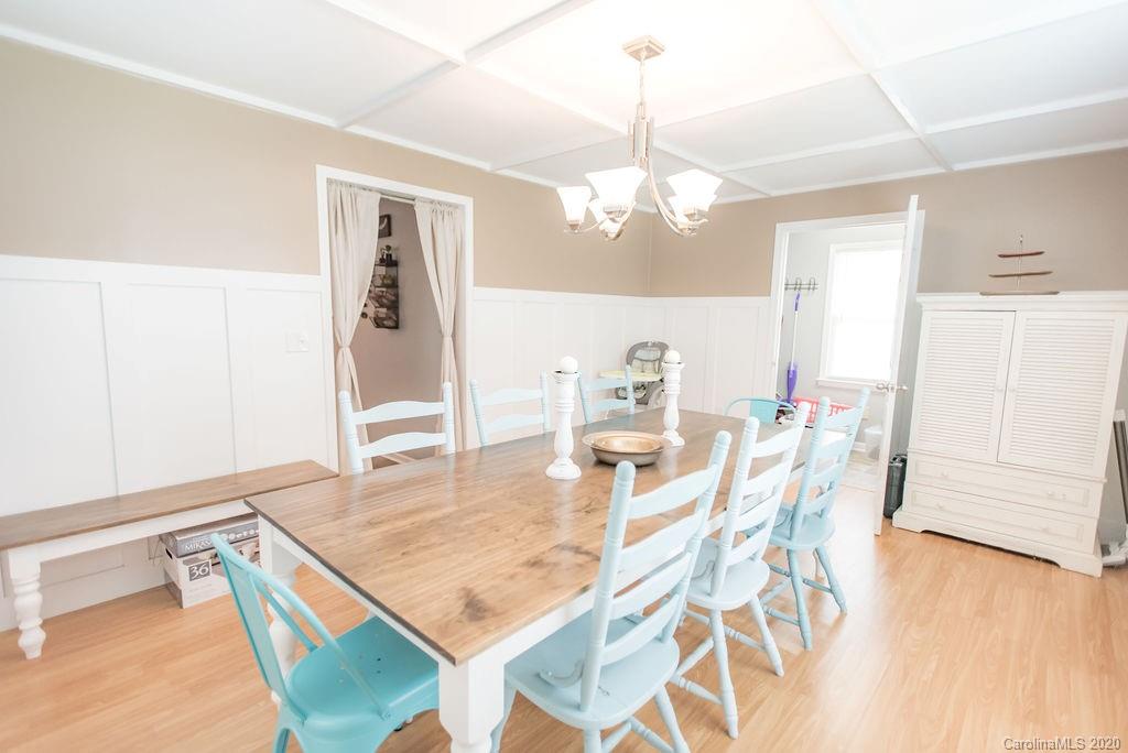 2519 Old Camden Road Monroe, NC 28110 - Photo 20 of 42 a view of a dining room with furniture and wooden floor