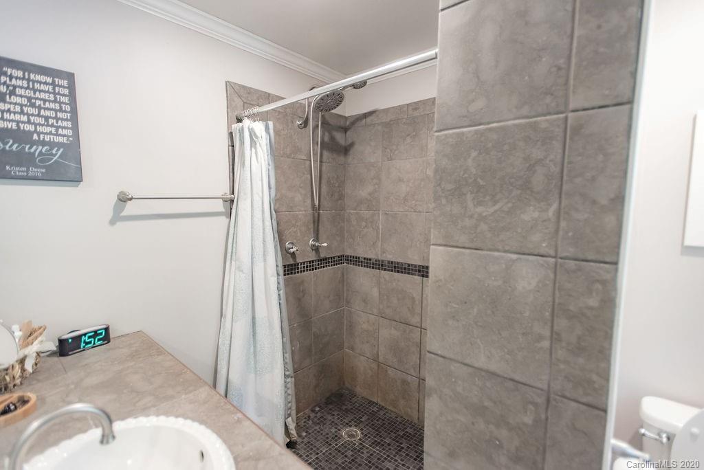 2519 Old Camden Road Monroe, NC 28110 - Photo 30 of 42 a bathroom with a sink toilet and shower
