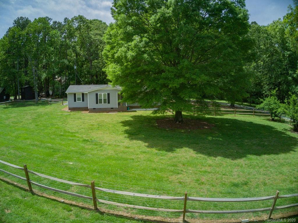 2519 Old Camden Road Monroe, NC 28110 - Photo 4 of 42 a view of a house with a big yard